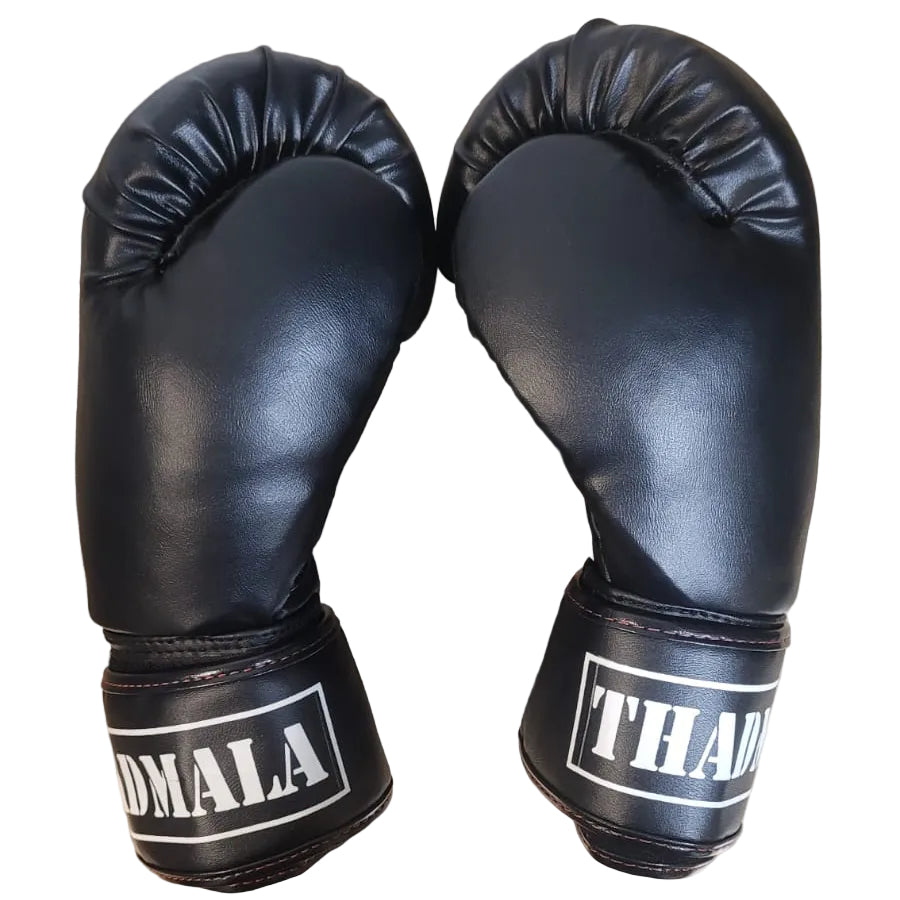 Pair of black boxing gloves with 'THANALIA' branding on a wooden surface.